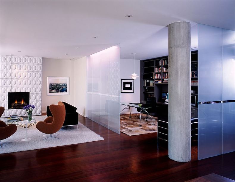 Frosted-glass-room-divider-separates-the-modern-living-room-from-the-beautiful-home-office