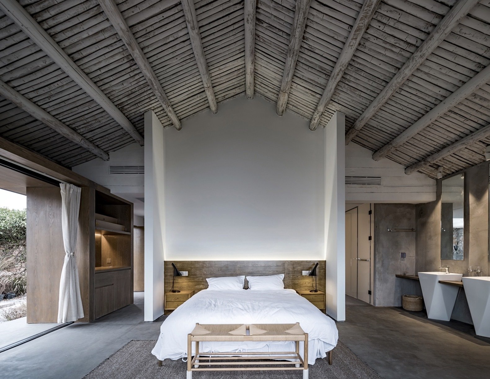 a-timber-beamed-ceiling-adds-a-rustic-touch-to-the-modern-master-suite