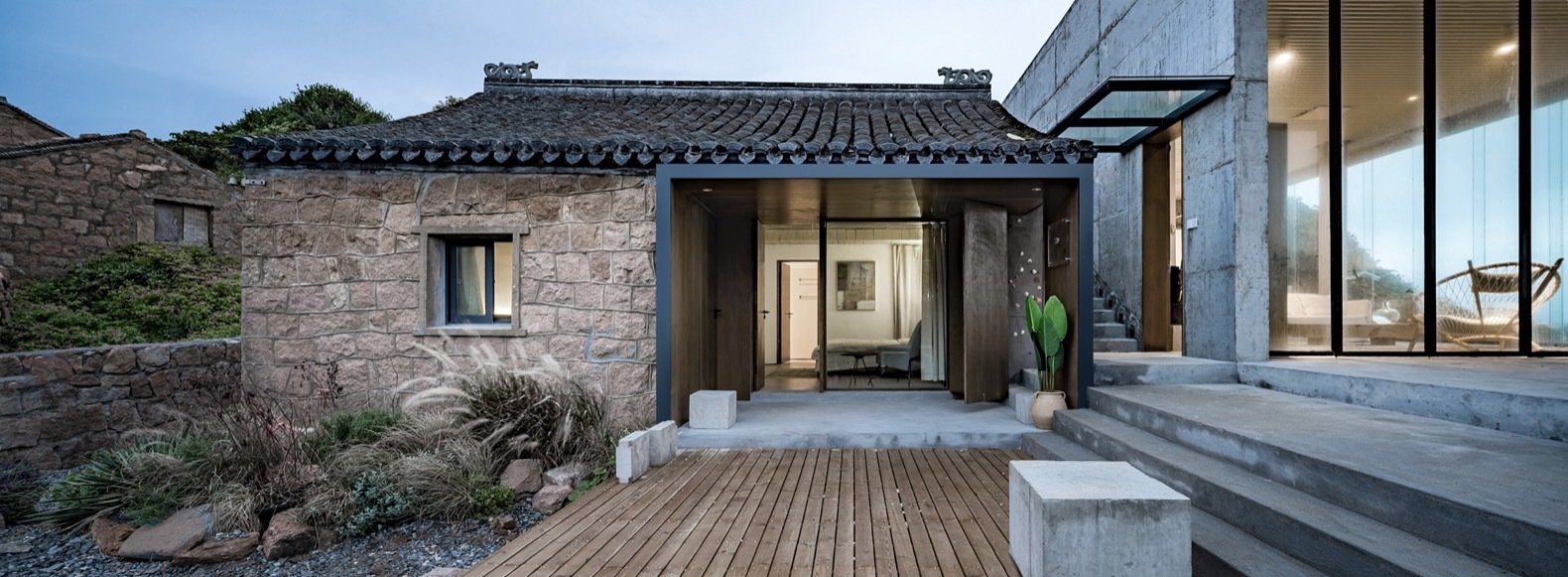 the-smaller-of-the-two-existing-buildings-this-renovated-structure-houses-two-bedrooms-a-glass-overhang-was-installed-above-the-pas