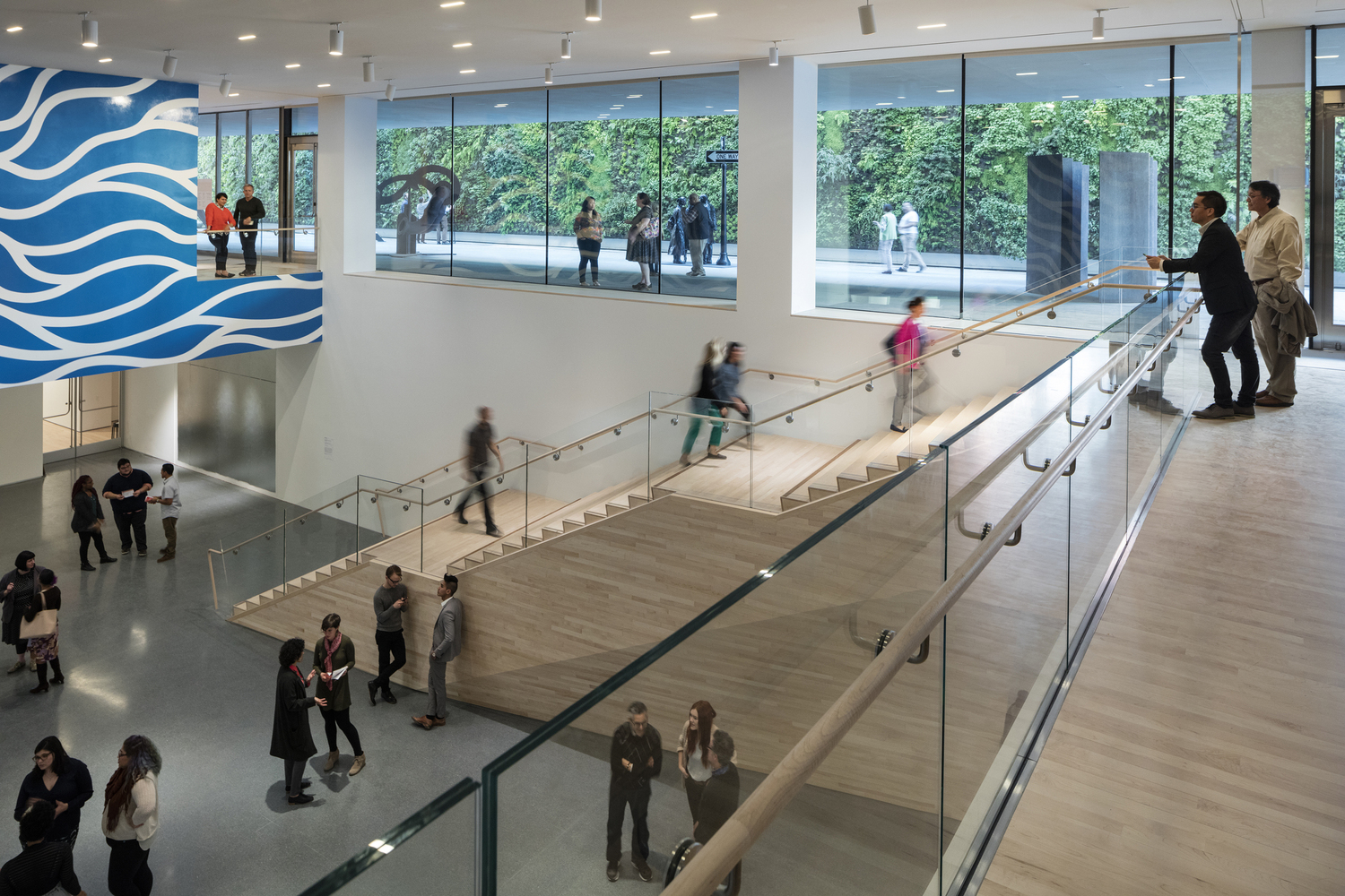 7._Helen_and_Charles_Schwab_Hall_featuring_Sol_Lewitt’s_Wall_Drawing_895_Loopy_Doopy_(white_and_blue)_(1999)_at_SFMOMA__photo_©_Henrik_Kam__courtesy_SFMOMA