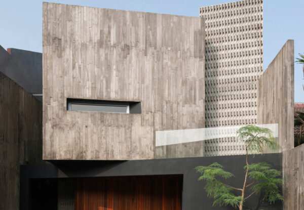 בית בטון עכשווי בעיצוב גיאומטרי ואדריכלות מינימליסטית